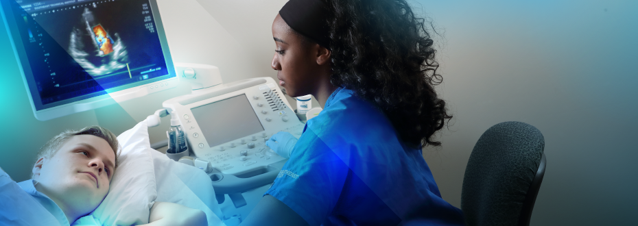 Student in scrubs using sonography machine on student patient