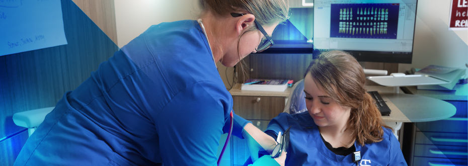 Woman in dental exam room smiling, dentist about to exam