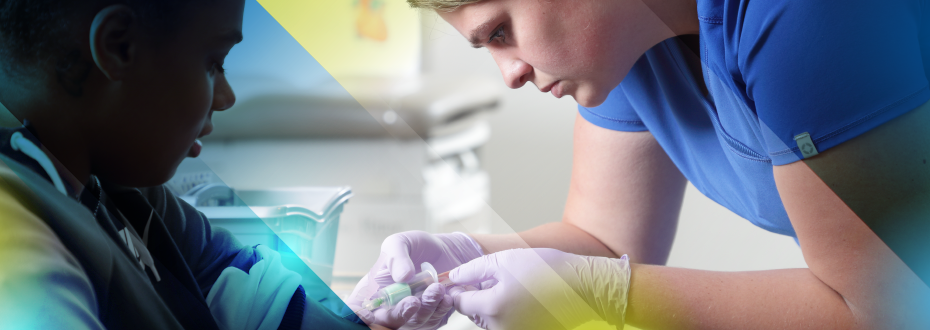 Students spinning vials of blood in machines in lab