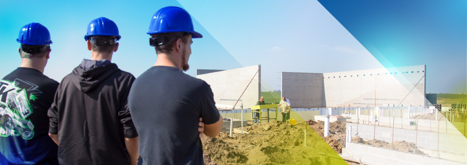 Instructor and student with laptop and auxiliary monitor reviewing CAD design